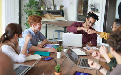 group of colleagues around a conference table